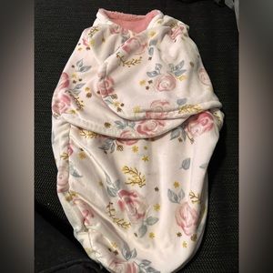 Floral swaddle. Never used. Only washed prior to having baby.